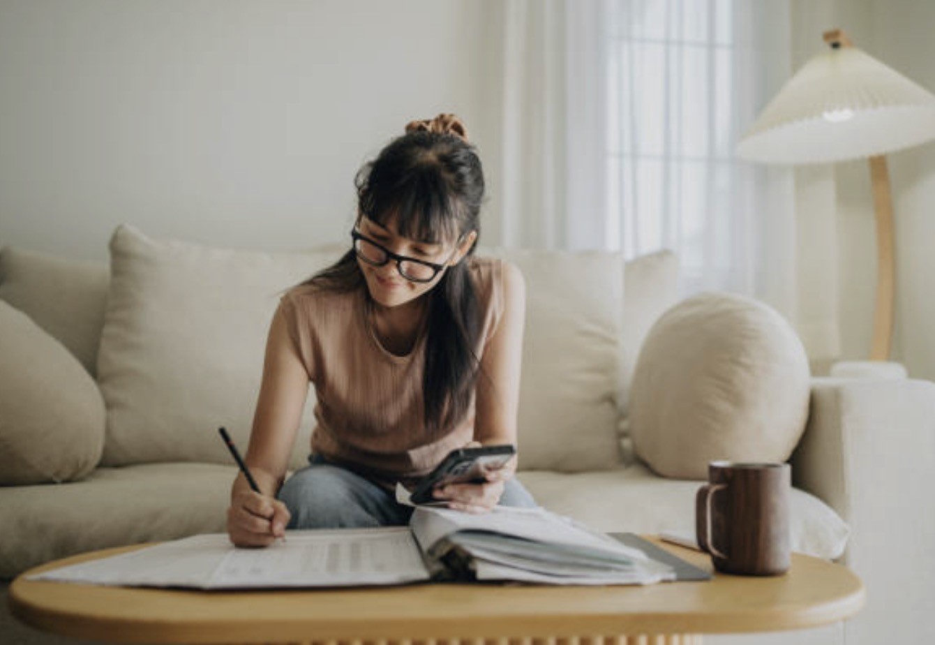 A person reviewing their finances at home
